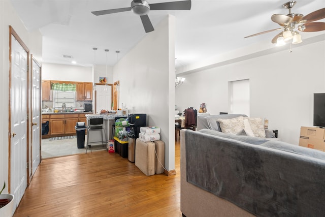 218 68th St, Guttenberg, NJ 07093 - living room featuring a ceiling fan and light wood finished floors