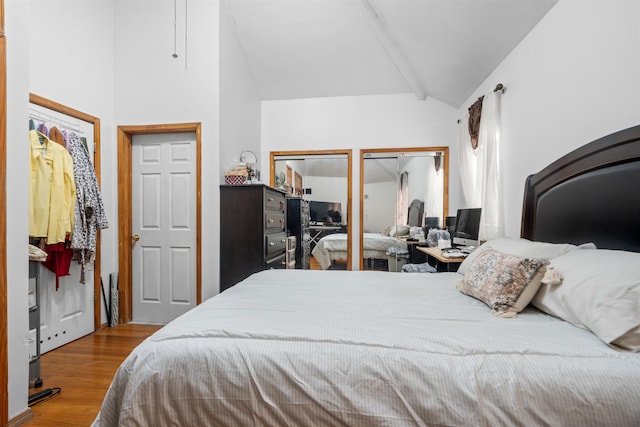 218 68th St, Guttenberg, NJ 07093 - bedroom featuring lofted ceiling, wood finished floors, and multiple closets