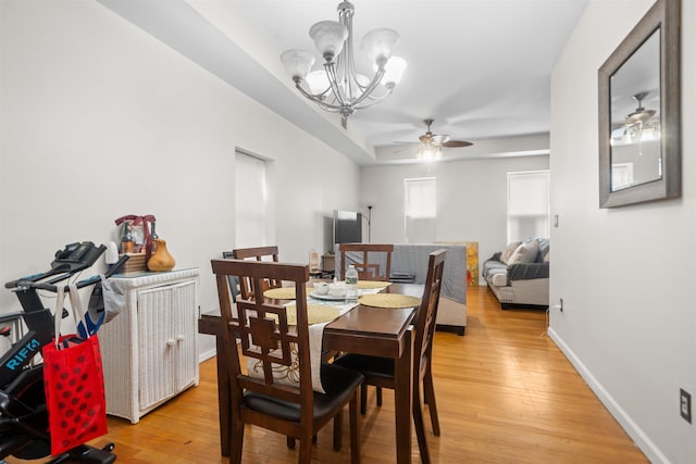218 68th St, Guttenberg, NJ 07093 - dining area featuring a ceiling fan, a chandelier, and light wood-type flooring