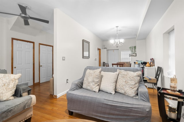 218 68th St, Guttenberg, NJ 07093 - living area with wood finished floors, a chandelier, and ceiling fan