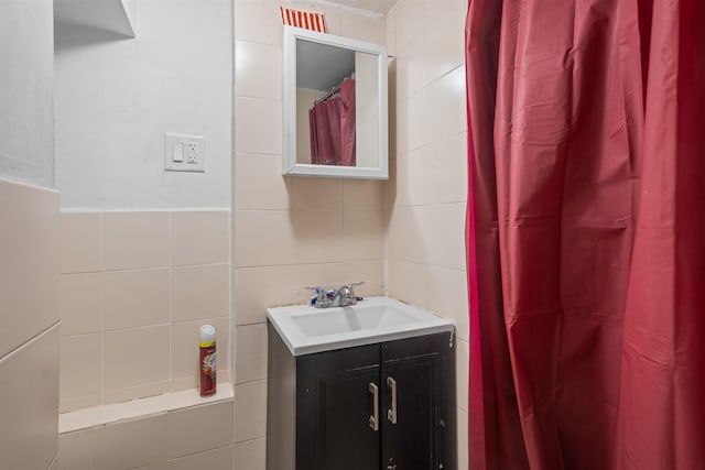 218 68th St, Guttenberg, NJ 07093 - full bathroom featuring tile walls, vanity, and a shower with curtain