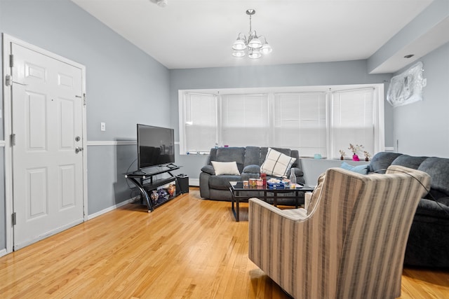 218 68th St, Guttenberg, NJ 07093 - living room with a chandelier and light wood finished floors