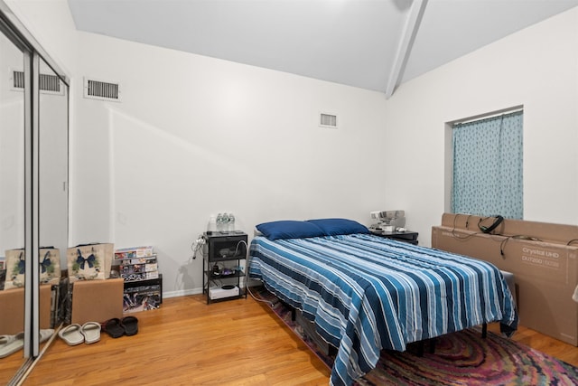 218 68th St, Guttenberg, NJ 07093 - bedroom featuring wood finished floors, vaulted ceiling, and a closet