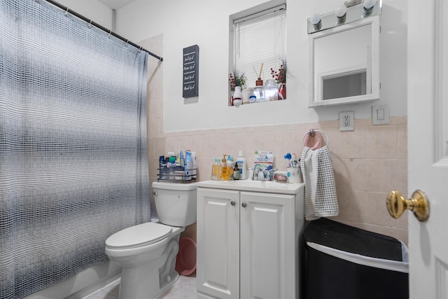 218 68th St, Guttenberg, NJ 07093 - bathroom with tile walls, vanity, curtained shower, tile patterned floors, and wainscoting