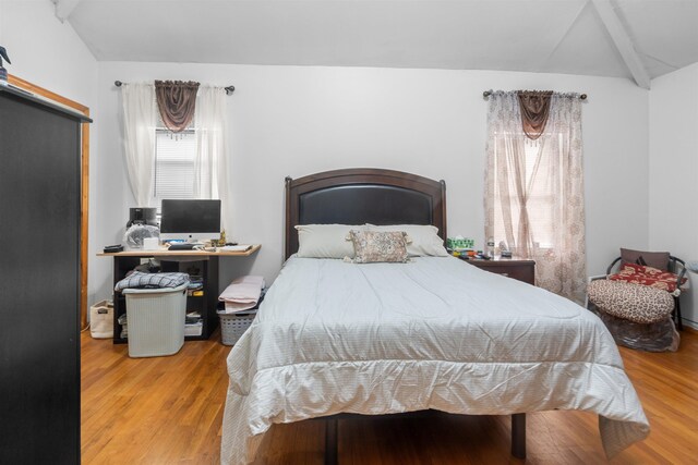 218 68th St, Guttenberg, NJ 07093 - bedroom featuring wood finished floors and a barn door