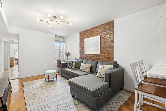 118 Clinton St Unit 7, Hoboken, NJ 07030 - living area with light wood-style floors, baseboards, and a chandelier