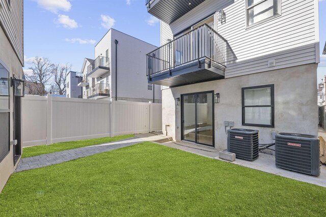 13 Manhattan Ave Unit 1, Jersey City, NJ 07307 - view of yard featuring central AC and a balcony