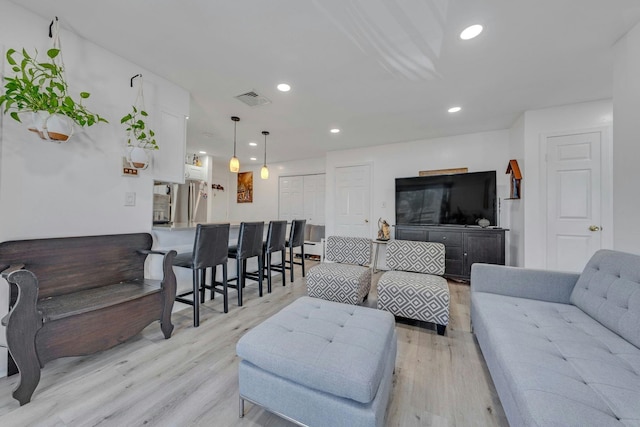 539 Bayway Cir Unit 2C, Elizabeth, NJ 07202 - living room featuring light wood-style flooring and recessed lighting