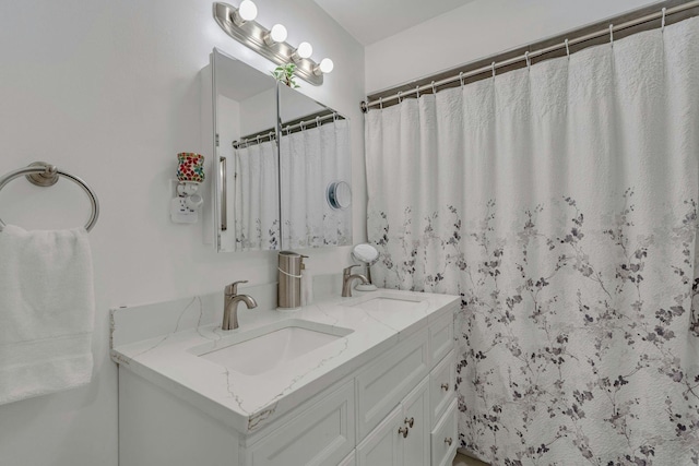 539 Bayway Cir Unit 2C, Elizabeth, NJ 07202 - bathroom with double vanity and curtained shower