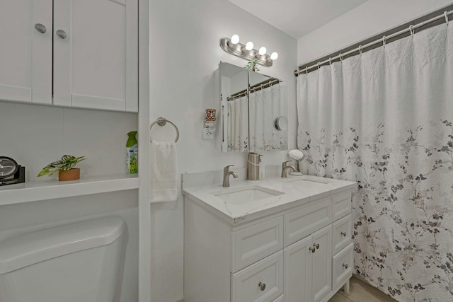 539 Bayway Cir Unit 2C, Elizabeth, NJ 07202 - full bath with toilet, double vanity, and a shower with shower curtain