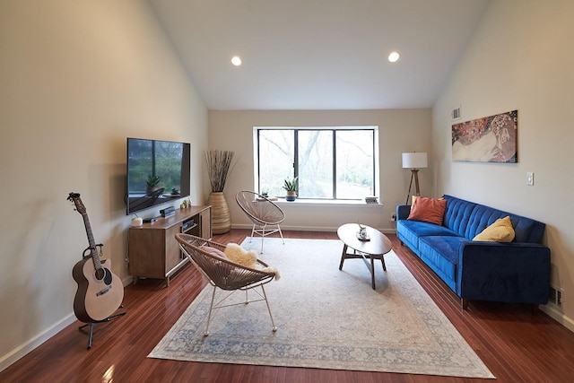 living room with high vaulted ceiling and dark hardwood / wood-style floors