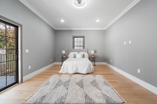 bedroom featuring access to outside, light wood finished floors, and baseboards