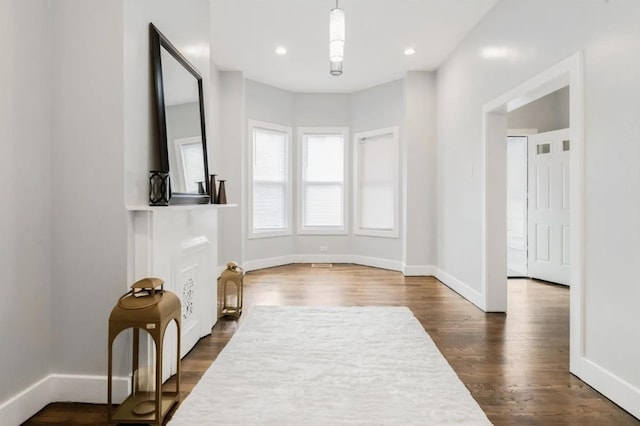 330 Forrest St, Jersey City, NJ 07304 - unfurnished living room featuring dark wood-type flooring and recessed lighting