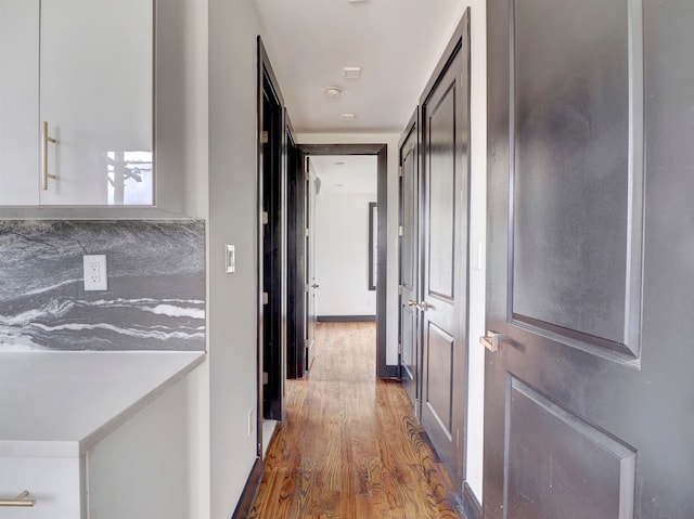 hallway featuring hardwood / wood-style floors