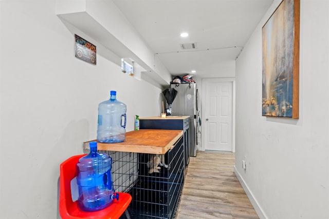 70 County Ave, Secaucus, NJ 07094 - hallway featuring light wood-type flooring, baseboards, and recessed lighting