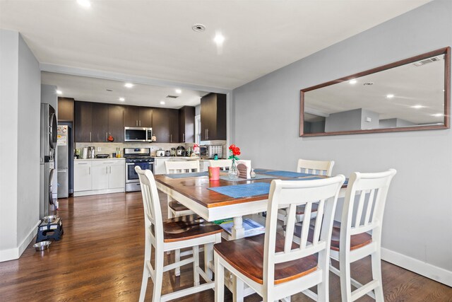 70 County Ave, Secaucus, NJ 07094 - dining room featuring dark wood-style floors, recessed lighting, and baseboards