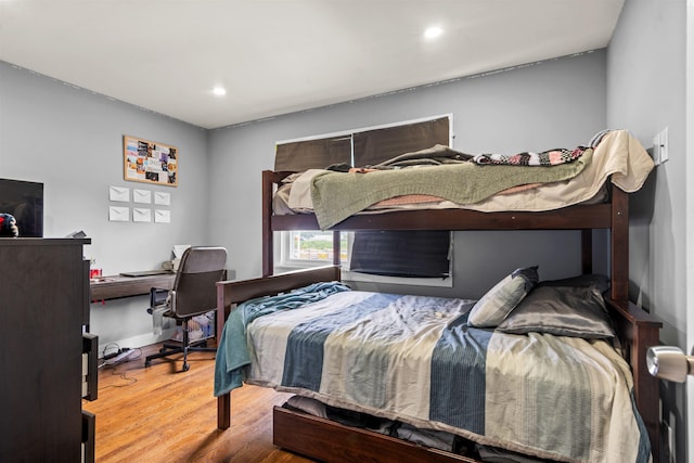 70 County Ave, Secaucus, NJ 07094 - bedroom with wood finished floors, an office area, and recessed lighting