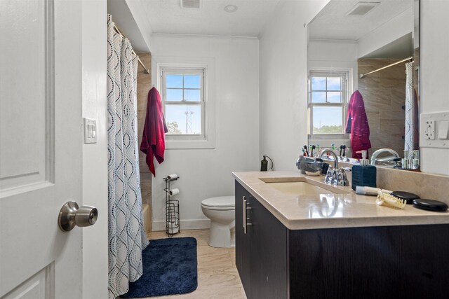 70 County Ave, Secaucus, NJ 07094 - bathroom featuring vanity, toilet, curtained shower, and baseboards