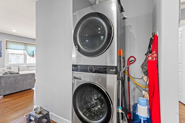 70 County Ave, Secaucus, NJ 07094 - laundry area featuring stacked washer and clothes dryer and wood finished floors