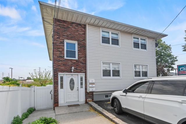 70 County Ave, Secaucus, NJ 07094 - view of front facade with a gate and brick siding