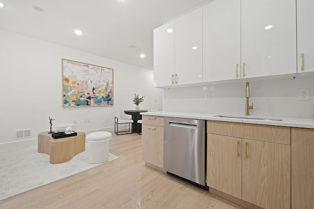 kitchen featuring dishwasher, sink, light hardwood / wood-style flooring, light brown cabinetry, and white cabinets