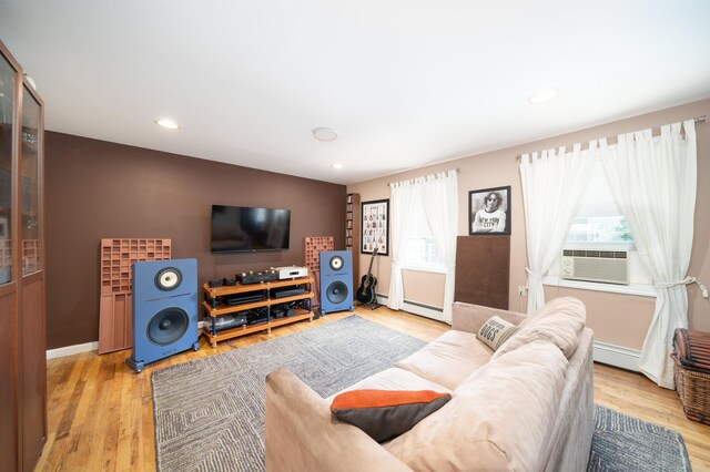 288 Barrow St Unit 2, Jersey City, NJ 07302 - living room featuring wood finished floors, cooling unit, recessed lighting, and baseboard heating