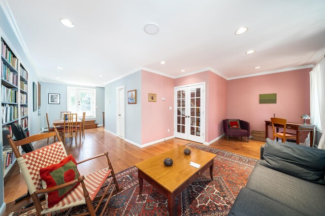 288 Barrow St Unit 2, Jersey City, NJ 07302 - living area with crown molding, recessed lighting, light wood finished floors, and french doors
