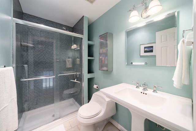 288 Barrow St Unit 2, Jersey City, NJ 07302 - bathroom featuring a stall shower and tile patterned flooring