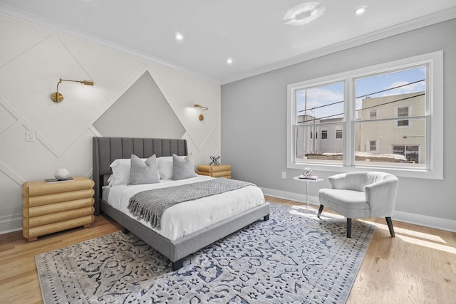 bedroom featuring ornamental molding, recessed lighting, light wood-style flooring, and baseboards