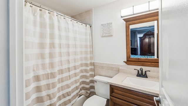 4401 Park Ave Unit 2B, Union City, NJ 07087 - full bathroom with tile walls, vanity, curtained shower, and a wainscoted wall