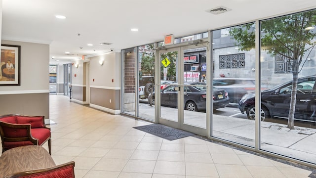4401 Park Ave Unit 2B, Union City, NJ 07087 - lobby with floor to ceiling windows, ornamental molding, and recessed lighting