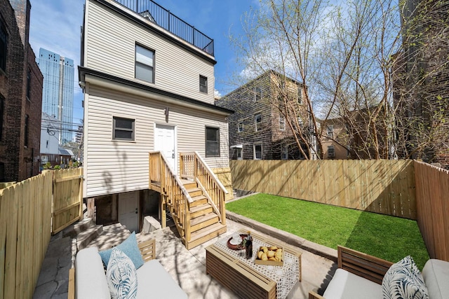 79 Vroom St Unit 1, Jersey City, NJ 07306 - rear view of property with an outdoor living space and a fenced backyard