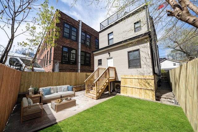 79 Vroom St Unit 1, Jersey City, NJ 07306 - rear view of house with a fenced backyard, an outdoor hangout area, and a patio area