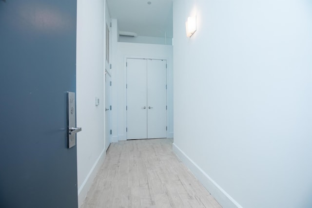 corridor featuring light hardwood / wood-style floors