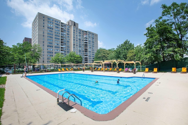 view of swimming pool with a pergola