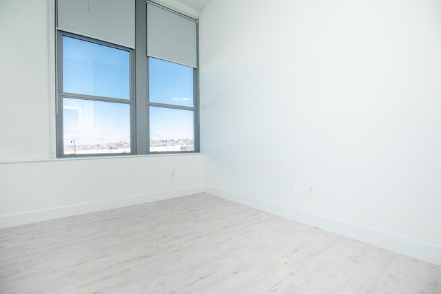 empty room with light wood-type flooring