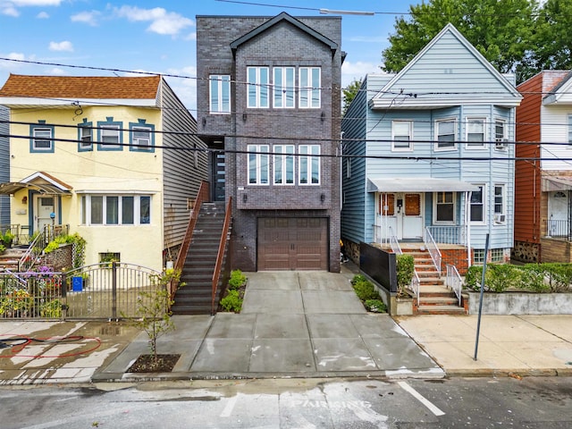 townhome / multi-family property featuring a garage