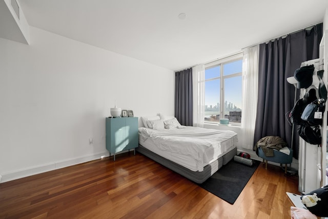 bedroom featuring wood-type flooring