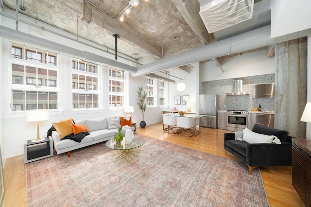 140 Bay St Unit 6G, Jersey City, NJ 07302 - living area with light wood-style flooring and baseboards
