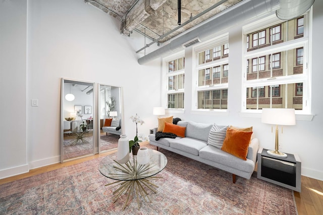 140 Bay St Unit 6G, Jersey City, NJ 07302 - living area with wood finished floors and a high ceiling