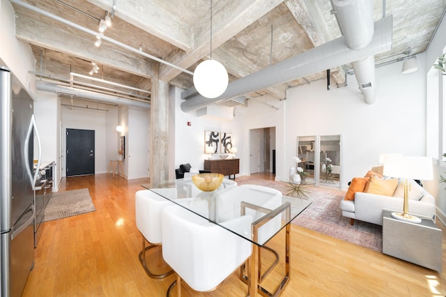 140 Bay St Unit 6G, Jersey City, NJ 07302 - dining space featuring track lighting and wood finished floors