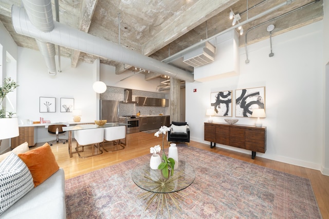 140 Bay St Unit 6G, Jersey City, NJ 07302 - living room with light wood finished floors and baseboards