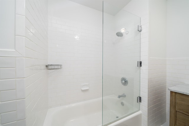 140 Bay St Unit 6G, Jersey City, NJ 07302 - bathroom with enclosed tub / shower combo, tile walls, vanity, and wainscoting