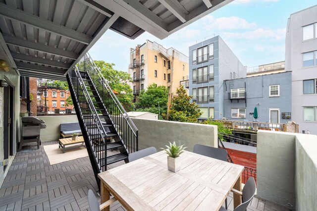833 Willow Ave Unit 2, Hoboken, NJ 07030 - balcony with stairway, outdoor dining area, and a grill