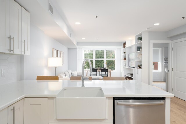 833 Willow Ave Unit 2, Hoboken, NJ 07030 - kitchen featuring dishwasher, white cabinets, light countertops, open floor plan, and recessed lighting