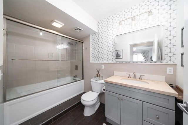 833 Willow Ave Unit 2, Hoboken, NJ 07030 - full bath with vanity, shower / bath combination with glass door, tile walls, and wood tiled floors