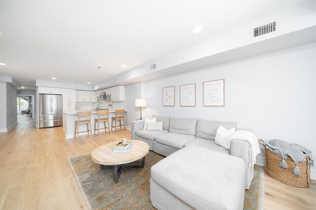 833 Willow Ave Unit 2, Hoboken, NJ 07030 - living room featuring light wood-style floors and recessed lighting