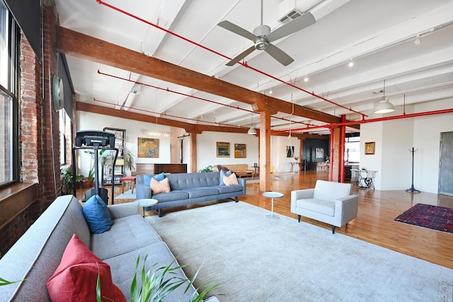 1620 Manhattan Ave Unit C3, Union City, NJ 07087 - living room featuring wood finished floors, a ceiling fan, and beam ceiling
