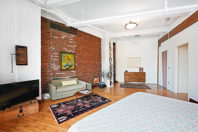 1620 Manhattan Ave Unit C3, Union City, NJ 07087 - bedroom featuring wood finished floors, brick wall, and beamed ceiling