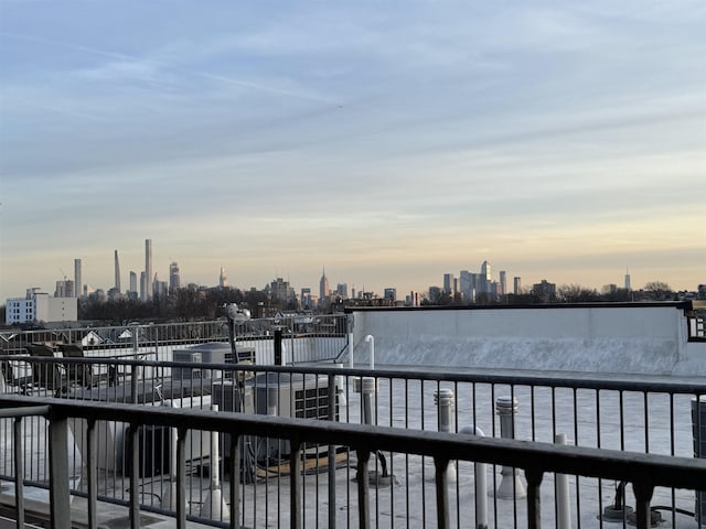 dock featuring a water view and a view of skyline